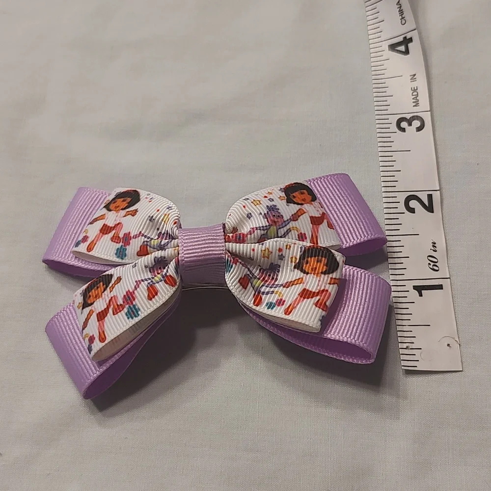 Dora the Explorer and polka dot purple bow lot x 2